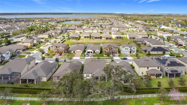 aerial view featuring a water view and a residential view