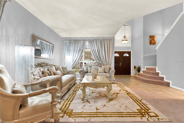living area with crown molding, stairway, carpet flooring, baseboards, and tile patterned floors
