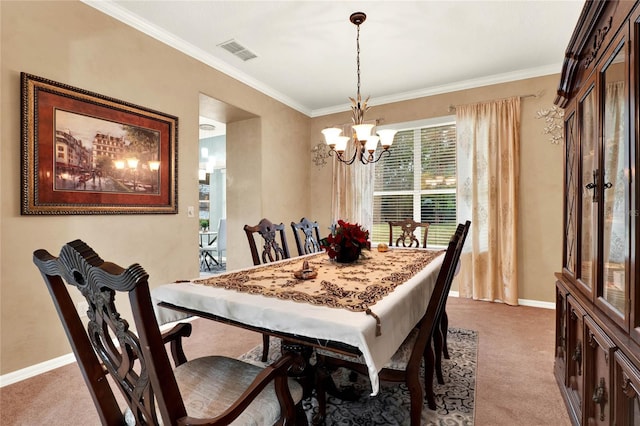 dining space featuring baseboards, ornamental molding, visible vents, and light colored carpet
