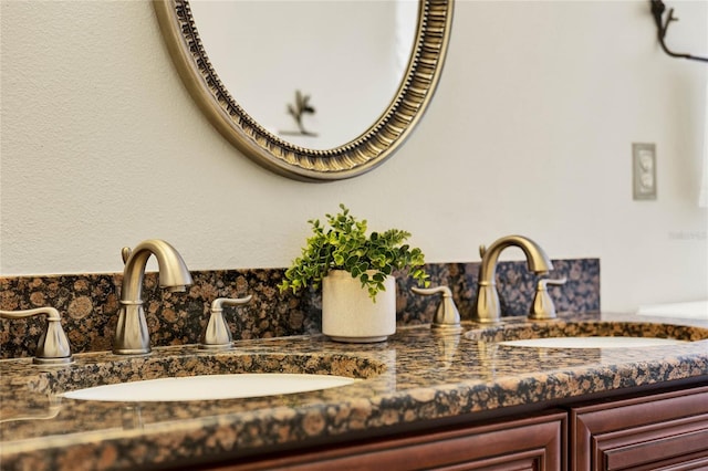 bathroom featuring double vanity and a sink