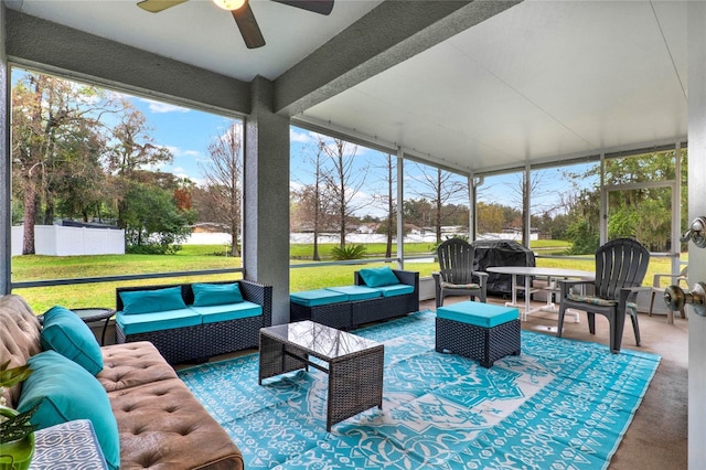 sunroom featuring a ceiling fan