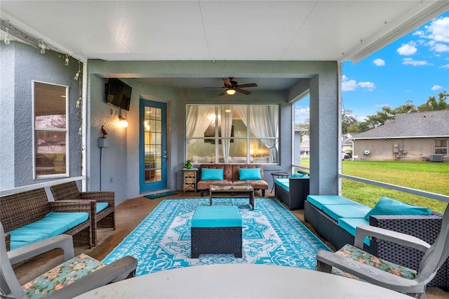 view of patio featuring an outdoor hangout area and a ceiling fan