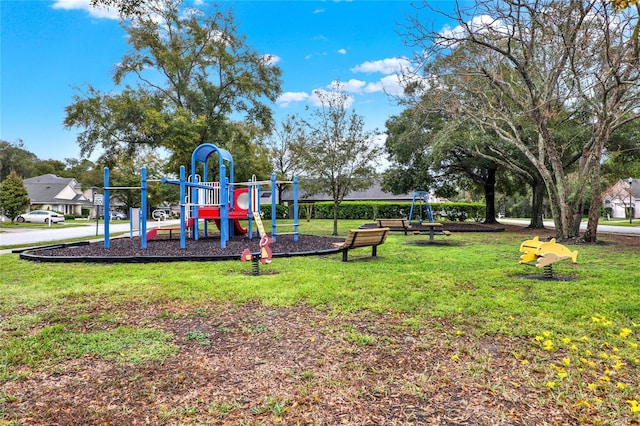 communal playground with a lawn