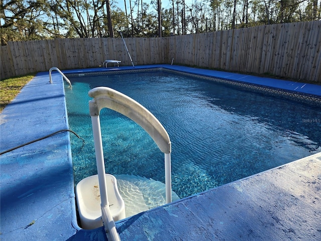 view of pool with a fenced backyard and a fenced in pool