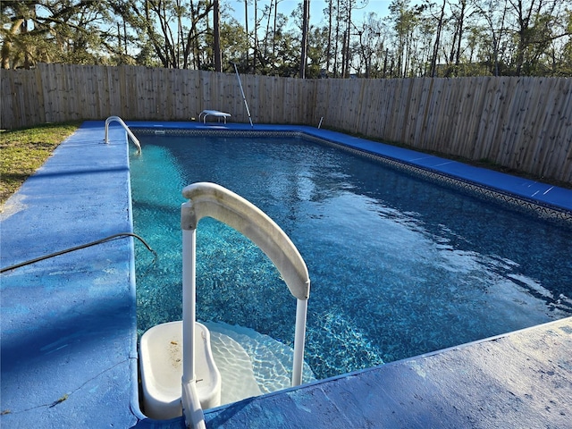 view of pool featuring a fenced in pool and a fenced backyard