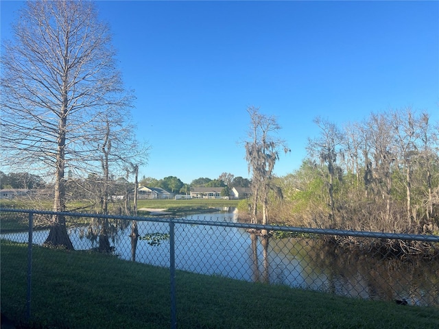 view of water feature featuring fence