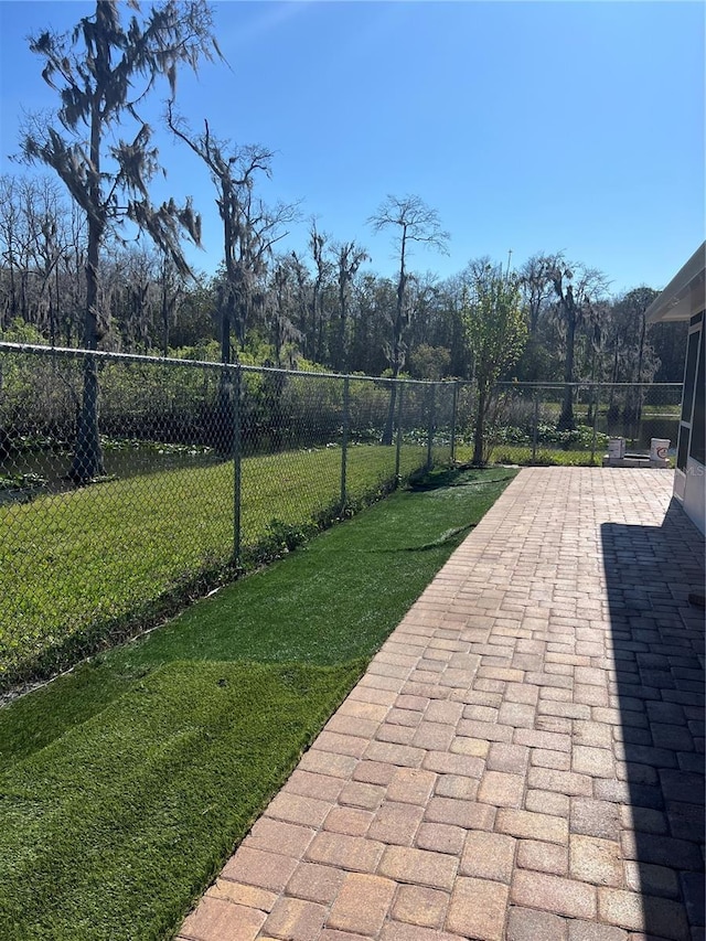 view of patio / terrace featuring fence