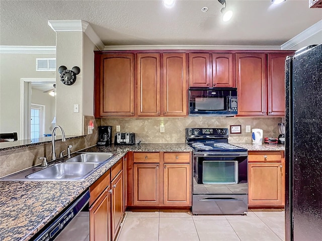 kitchen featuring light tile patterned floors, a sink, visible vents, ornamental molding, and black appliances