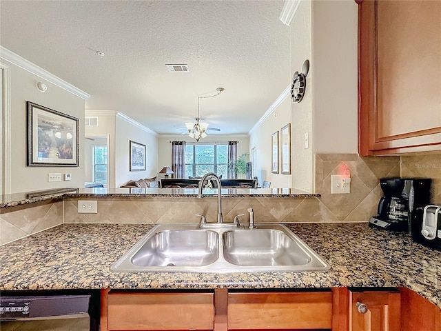 kitchen featuring black dishwasher, visible vents, a sink, crown molding, and backsplash