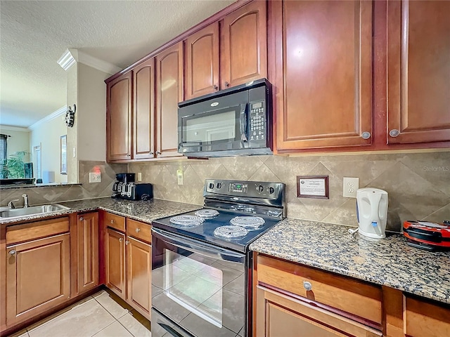 kitchen with a textured ceiling, a sink, dark stone counters, black appliances, and crown molding