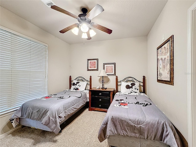 bedroom with visible vents and a ceiling fan