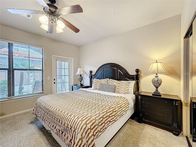 bedroom with ceiling fan and baseboards