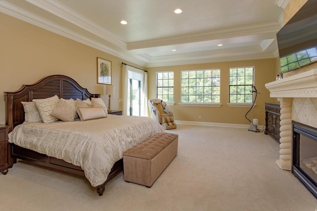 5719 Emerson Pointe Way, Orlando, FL 32819 - bedroom with baseboards, light colored carpet, crown molding, and a glass covered fireplace