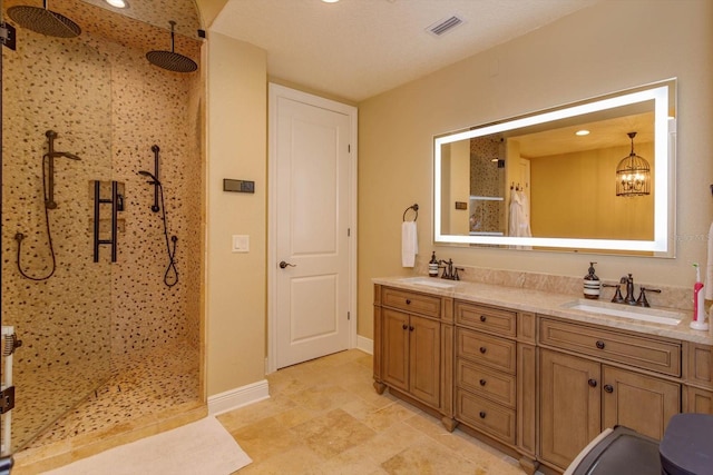 5719 Emerson Pointe Way, Orlando, FL 32819 - bathroom featuring double vanity, visible vents, a walk in shower, and a sink