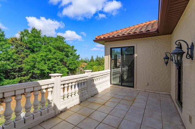 5719 Emerson Pointe Way, Orlando, FL 32819 - view of patio with a balcony