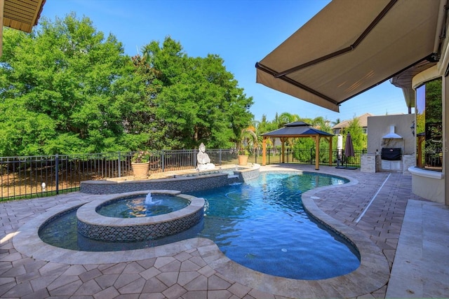 5719 Emerson Pointe Way, Orlando, FL 32819 - view of swimming pool with a patio area, a pool with connected hot tub, fence, and a gazebo