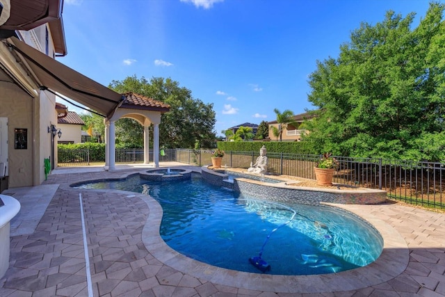 5719 Emerson Pointe Way, Orlando, FL 32819 - view of swimming pool featuring a fenced backyard, a pool with connected hot tub, and a patio