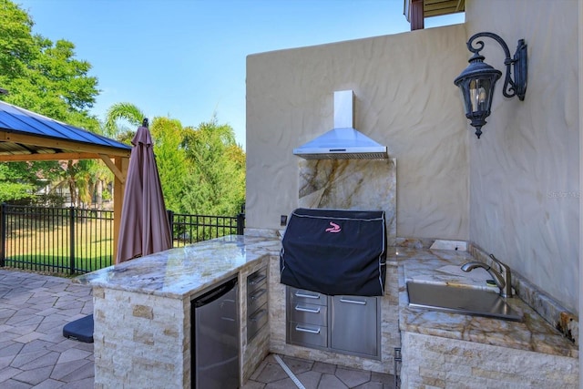 5719 Emerson Pointe Way, Orlando, FL 32819 - view of patio with area for grilling, exterior bar, fence, exterior kitchen, and a gazebo