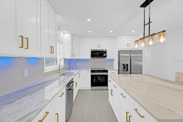 kitchen featuring tasteful backsplash, electric range, dishwasher, stainless steel refrigerator with ice dispenser, and a sink