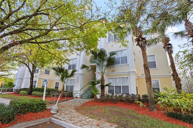 view of property featuring stairway