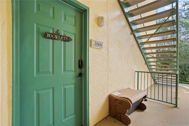 property entrance featuring stucco siding