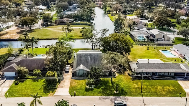 birds eye view of property featuring a water view and a residential view