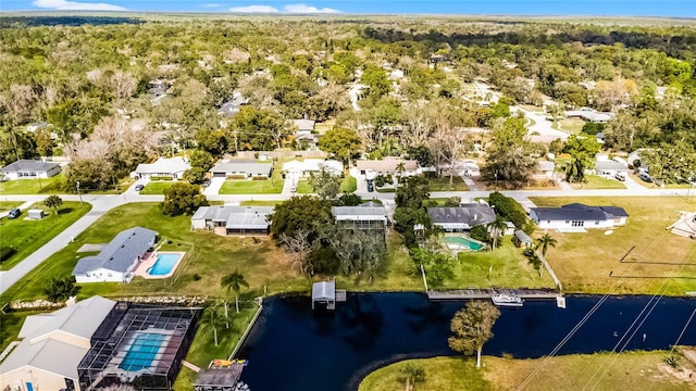 bird's eye view featuring a water view and a residential view