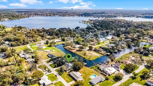 drone / aerial view featuring a residential view and a water view