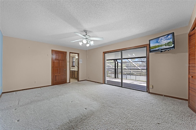 unfurnished room with light carpet, ceiling fan, baseboards, and a textured ceiling