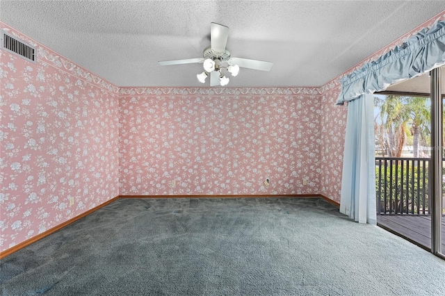 carpeted empty room featuring wallpapered walls, baseboards, visible vents, and a textured ceiling