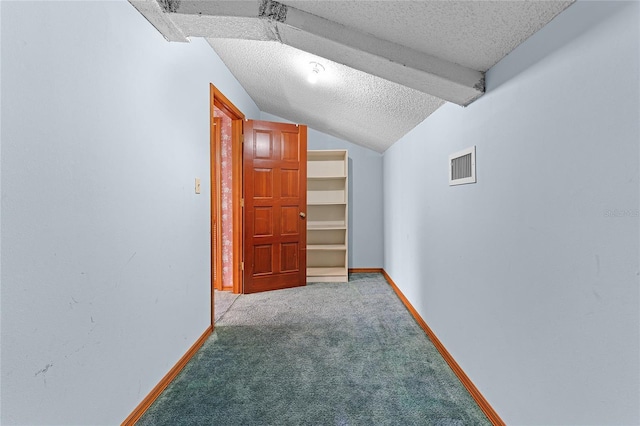 additional living space with a textured ceiling, visible vents, baseboards, vaulted ceiling, and carpet