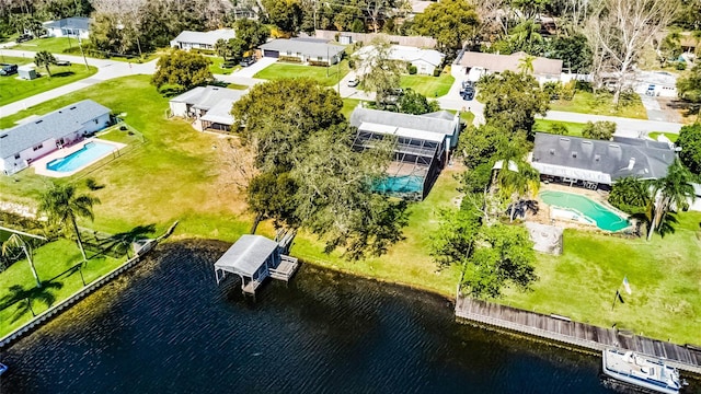 bird's eye view featuring a water view and a residential view