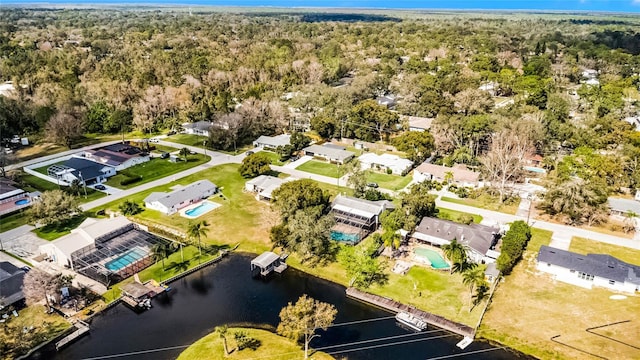 bird's eye view featuring a water view and a residential view