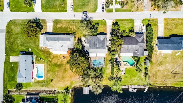 aerial view featuring a water view and a residential view