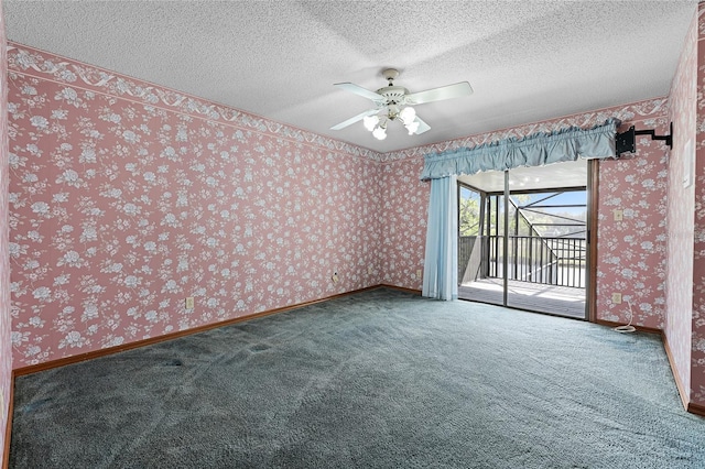 carpeted empty room with a textured ceiling, baseboards, a ceiling fan, and wallpapered walls