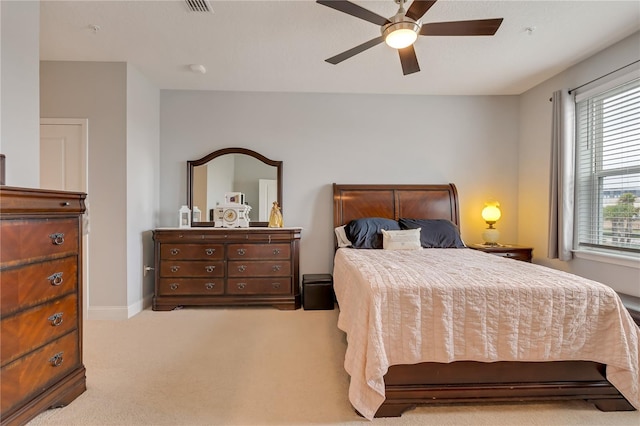 bedroom with carpet floors, baseboards, and a ceiling fan