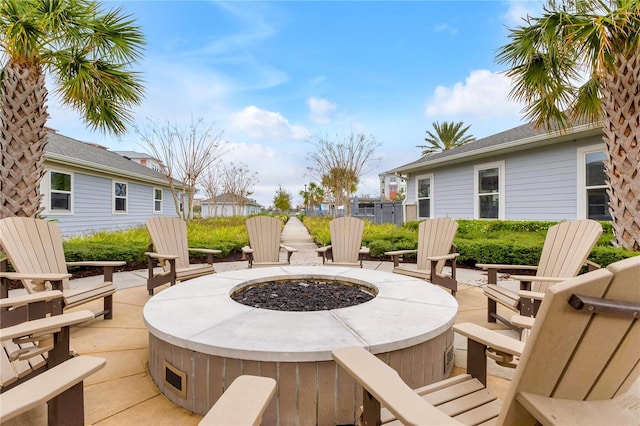 deck with fence, a fire pit, and a patio