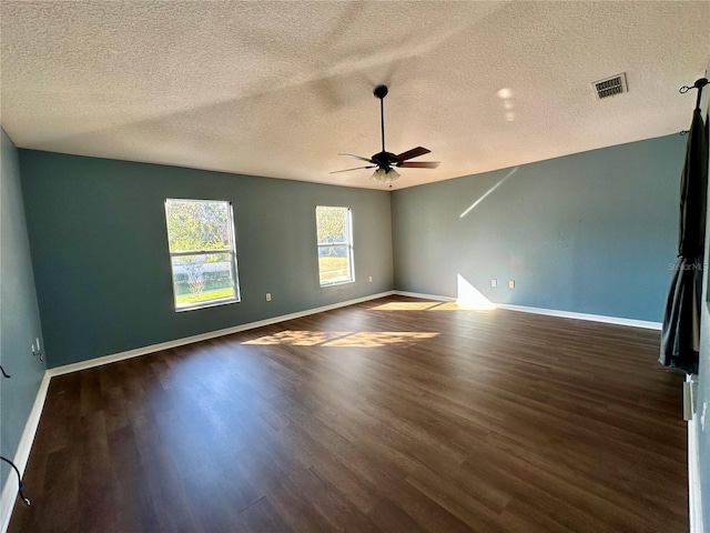 2143 Tealwood Cir, Tavares, FL 32778 - empty room featuring ceiling fan, baseboards, visible vents, and dark wood finished floors