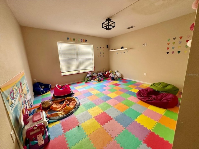 2143 Tealwood Cir, Tavares, FL 32778 - game room with carpet, visible vents, and baseboards