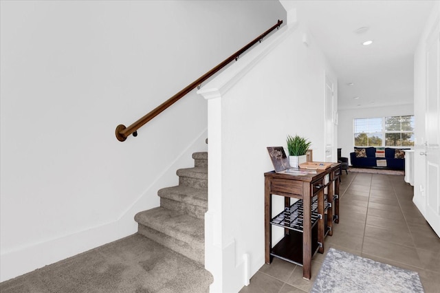 staircase featuring recessed lighting and tile patterned floors