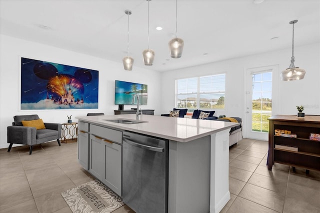 kitchen featuring gray cabinets, light countertops, hanging light fixtures, a sink, and dishwasher