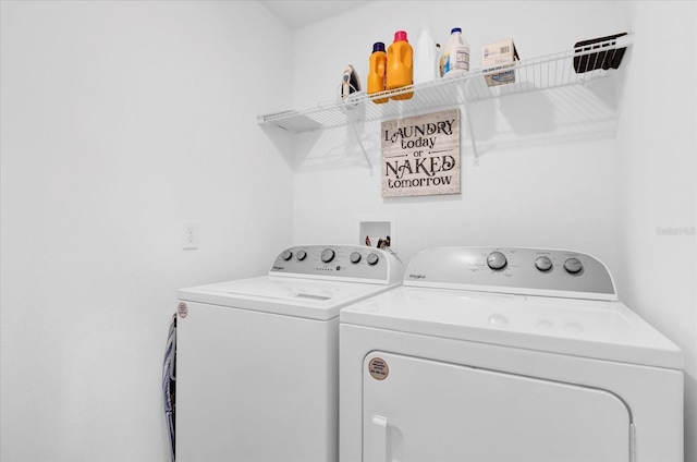 clothes washing area with laundry area and separate washer and dryer