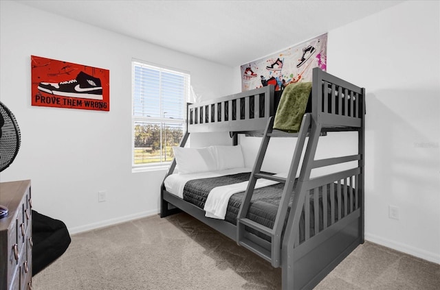 bedroom featuring carpet flooring and baseboards