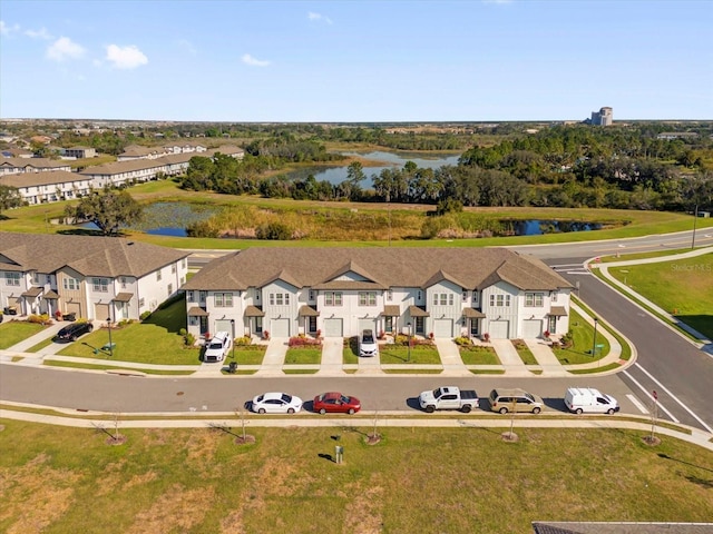 birds eye view of property featuring a water view and a residential view