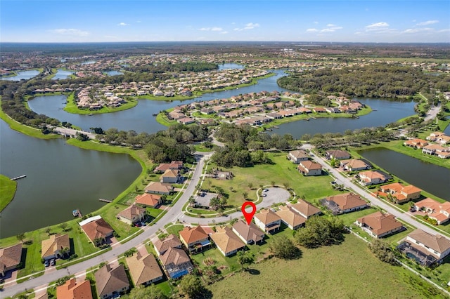 bird's eye view with a residential view and a water view