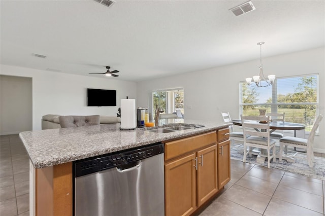 kitchen with light tile patterned floors, visible vents, a kitchen island with sink, a sink, and dishwasher