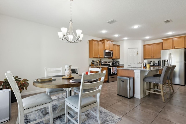 dining room with light tile patterned floors, a chandelier, visible vents, and recessed lighting