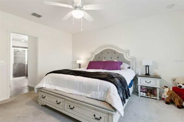 bedroom with a ceiling fan, visible vents, and light colored carpet