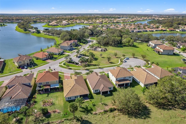 birds eye view of property with a residential view and a water view