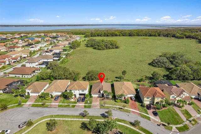 bird's eye view with a water view and a residential view